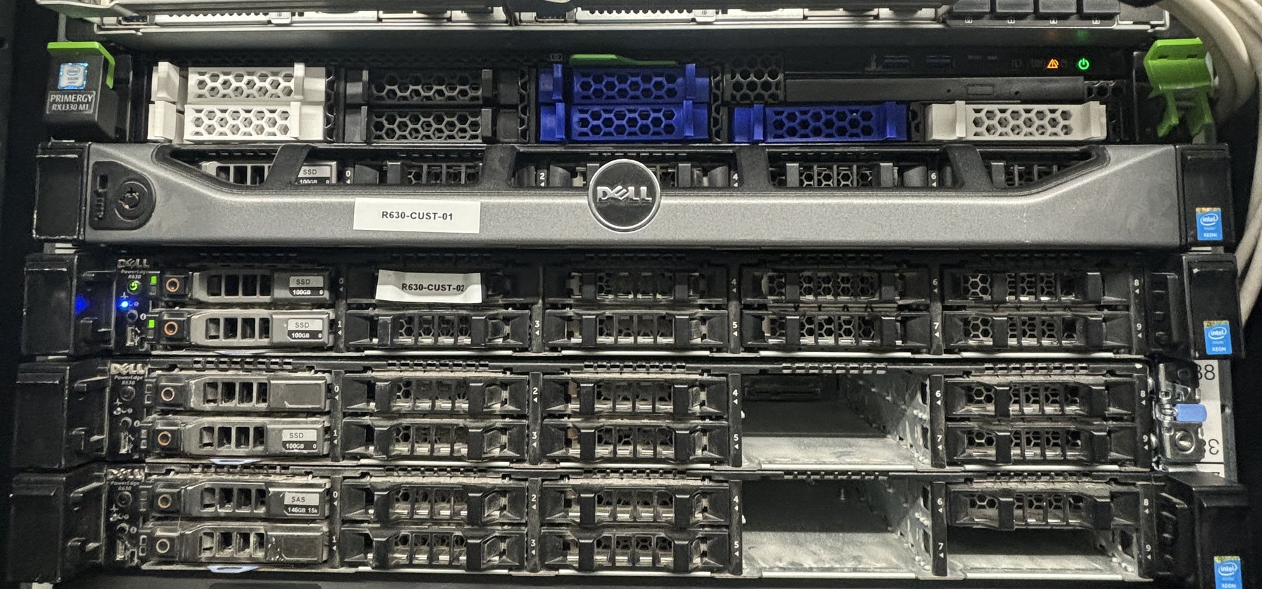 The front of an mTxServ rack: stacked chassis, drive caddies and status lights.